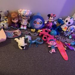 Girls fun toy lot.  Includes Elsa Anna frozen toys, stuffy’s, unicorns, fun dolls, trolls, purses, Minnie Mouse dancing and light up sing along toy., 