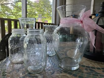 Three Large Glass Vases and Two Mason Bottles