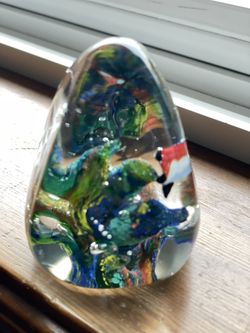 vintage hand-blown art glass paperweight, often described as having an "aquarium" or "underwater" scene.  
