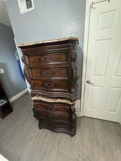 2 wooden bedside tables with marble tops
