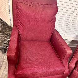 Two Red Reclining Chairs