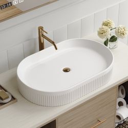 Oval vessel sink with a unique vertical striped body