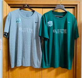 Two XXL Nike Dri-FIT t-shirts with Milltown United Soccer & Eleete Real Estate logo.