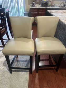 Cream leather bar chairs