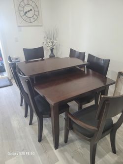  formal dining table with extension and 6 chairs