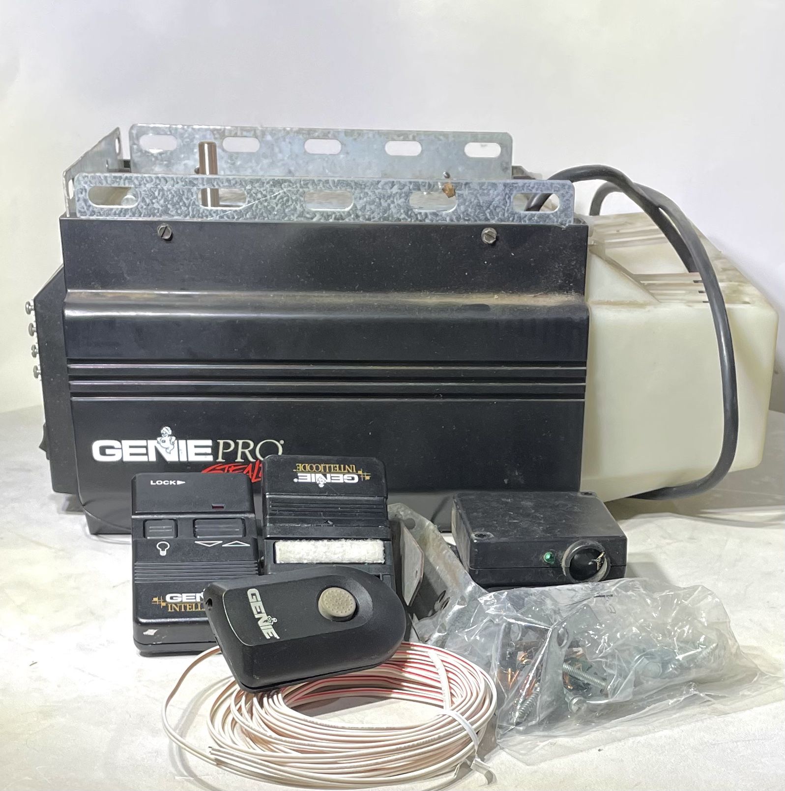 Genie Pro Stealth garage door opener w/2 remotes,sensors & brackets