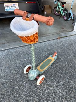 Kith x Banwood three-wheel scooter with a wicker basket