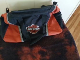 Black and orange Harley Davidson duffel bag