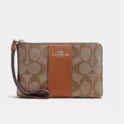 New COACH CORNER ZIP WRISTLET IN SIGNATURE CANVAS