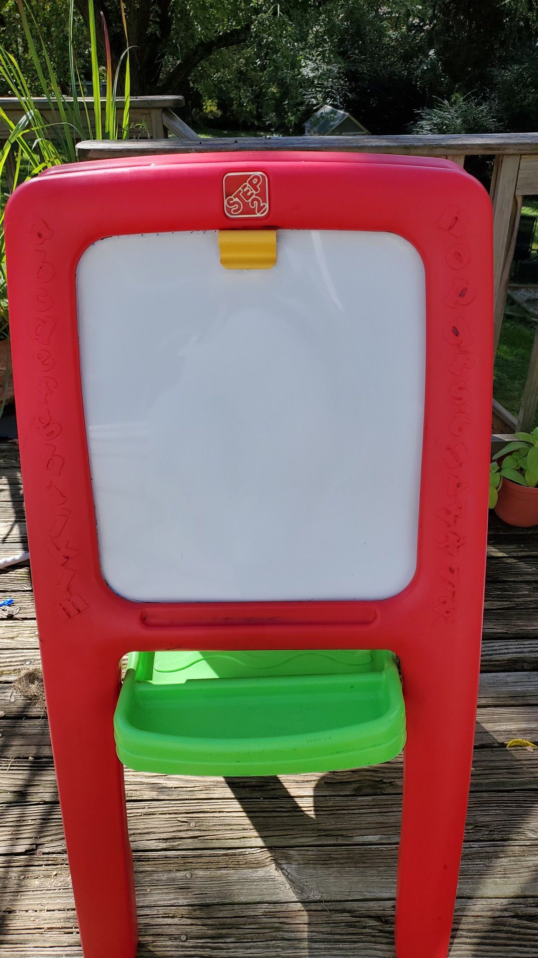 Step 2 kids art easel for two , dry erase board on one side and green chalkboard on the other side.