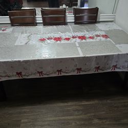 wood expandable table and 8 chairs