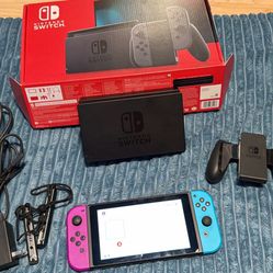 Nintendo switch with box, docking station, joycon grip, and hdmi. No trades cash only. 
