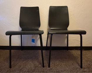 Set of 2 Target Room Essentials Stackable Chairs – Black  Set of two black Target Room Essentials stackable chairs featuring a durable steel frame wit