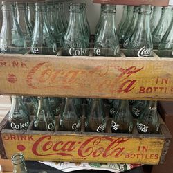 2 case of 24 vintage coca cola bottles with case. Total 48 bottles. All different cities made.
