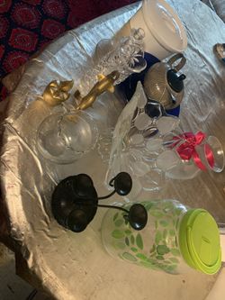 Candle holder, flowerpot, Dish of food, Teapot, and some antique things.