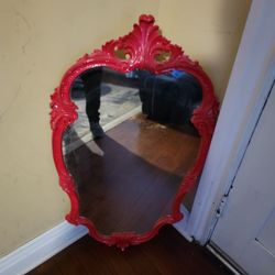 Astoria Grand Oval Framed Wall Mirror with a Glossy Cherry Red 39x21