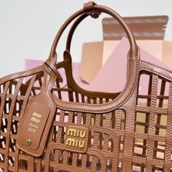 The exquisite woven pattern outlines the unique structure of this small and soft leather basket.