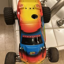 Two  XTM  X-CELLERATOR Nitro Stadium Trucks