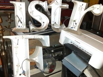 Letters. Metal wood plastic.