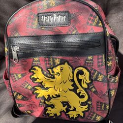 This is a Harry Potter - Loungefly - Gryffindor - Mini Backpack.  Red and black with a yellow lion