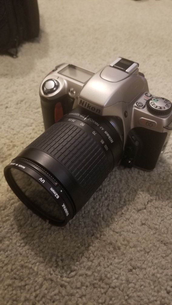 Nikon N65QD with lens and bag