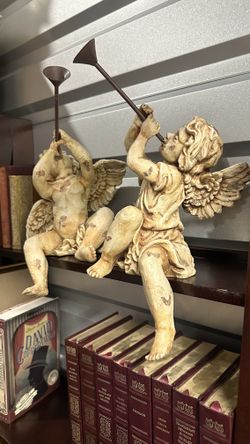 2 angles with trumpets