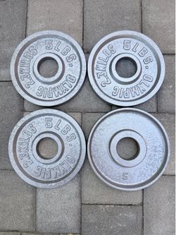 2 Pairs of 5 pound Olympic weights