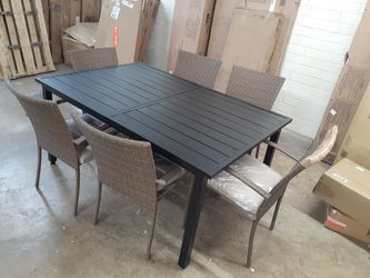 New metal table and 6 wickers chairs cushions included