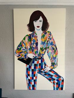 Woman in color, blouse, and pants