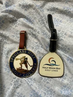 Two used golf bag tags