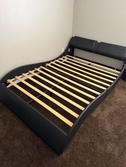 Queen size black leather bed