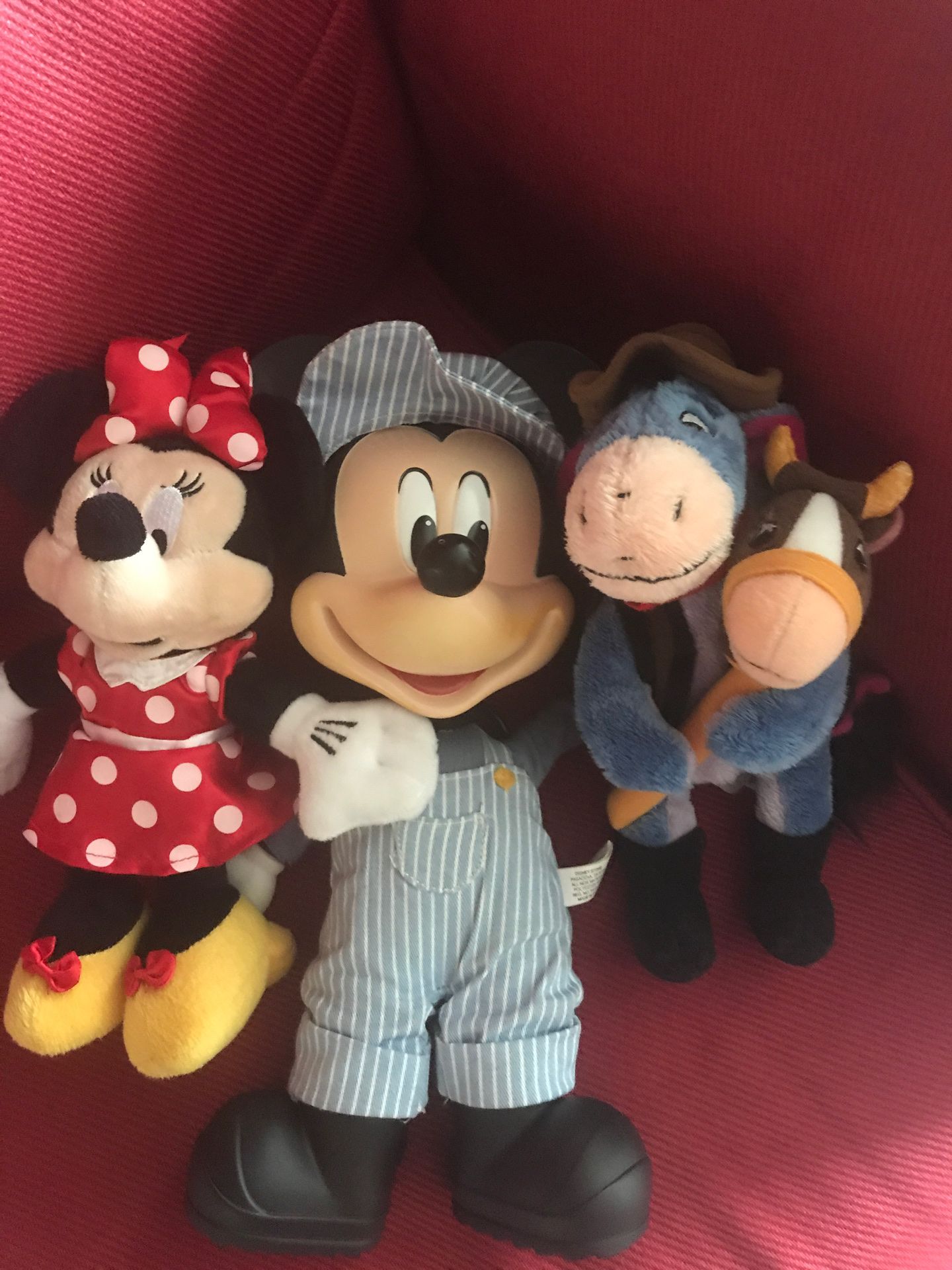 Disney plush toys including Mickey, Minnie, eeyore