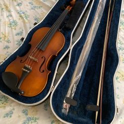Violin and case included as Pictured