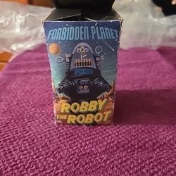 Robby el robot, de la película Planeta Prohibido (1997), fabricado en Japón, juguete de cuerda que funciona.