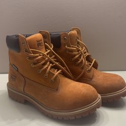 Woman’s Steel Toe Timberlands. 