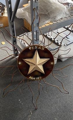 Texas Aggies Sun; light Bible Behind The Metal Decor