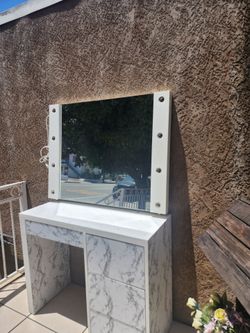 Beautiful nightstand with lighted mirror and drawers