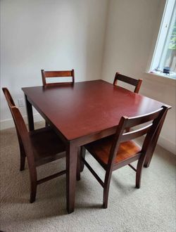 Wooden dining table with 4 chairs