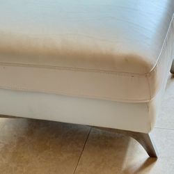 Leather ottoman with stainless legs