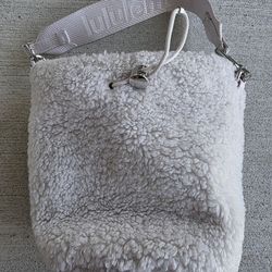 Authentic Lululemon Sherpa Fleece Bucket Bag in soft white/cream color.