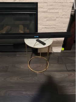 Soundbar with Bluetooth connectivity and remote control.