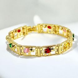 18k Gold Plated Multi Elephant Charm Clip Clasp Bracelet, 7.5 inches/Pulsera con cierre de clip y dije de elefante múltiple bañada en oro de 18 k, 7,5