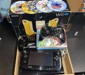 Wii U with games and controllers