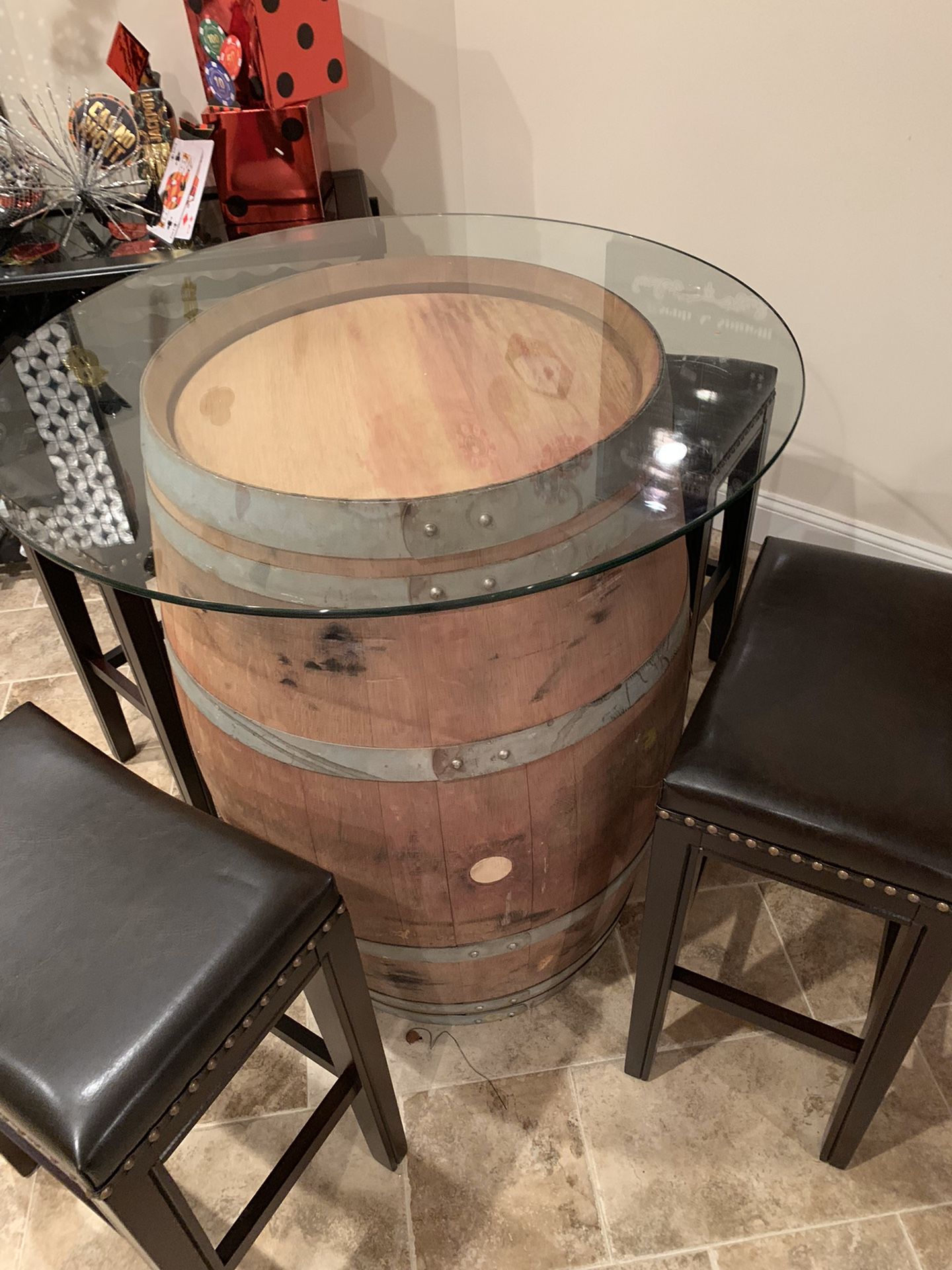 Wine barrel table and 4 leather stools