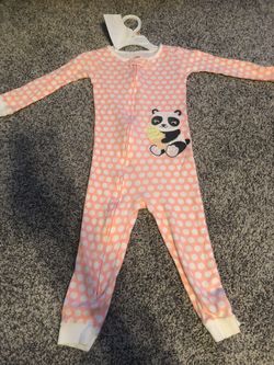 Orange with white polka dots. Carters onsie. Sized 2T