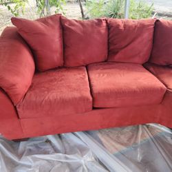2-piece Curved Red Sectional Couch (By ASHLEY FURN.)
