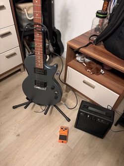 Electric Guitar with Amp and Distortion Pedal