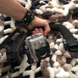 GoPro,  Comes With Handle  And Other Accessories. 