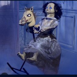 Lil Rocking Rosie animatronic Spirit Halloween doll prop 