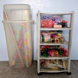 Two Rubbermaid Storage containers full of wrapping paper/ribbons, etc